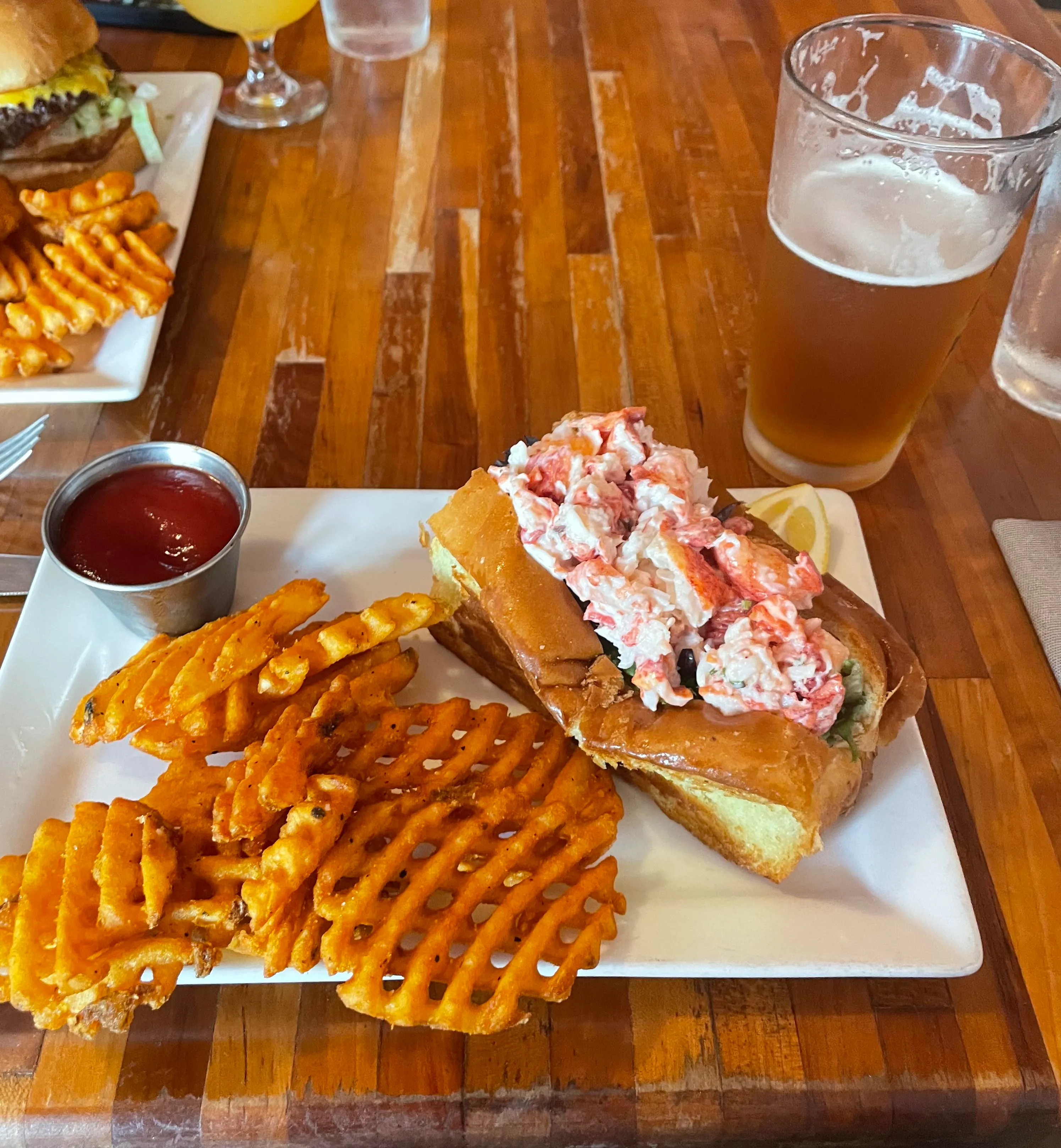 Delicious Maine lobster roll after hiking in Acadia National Park