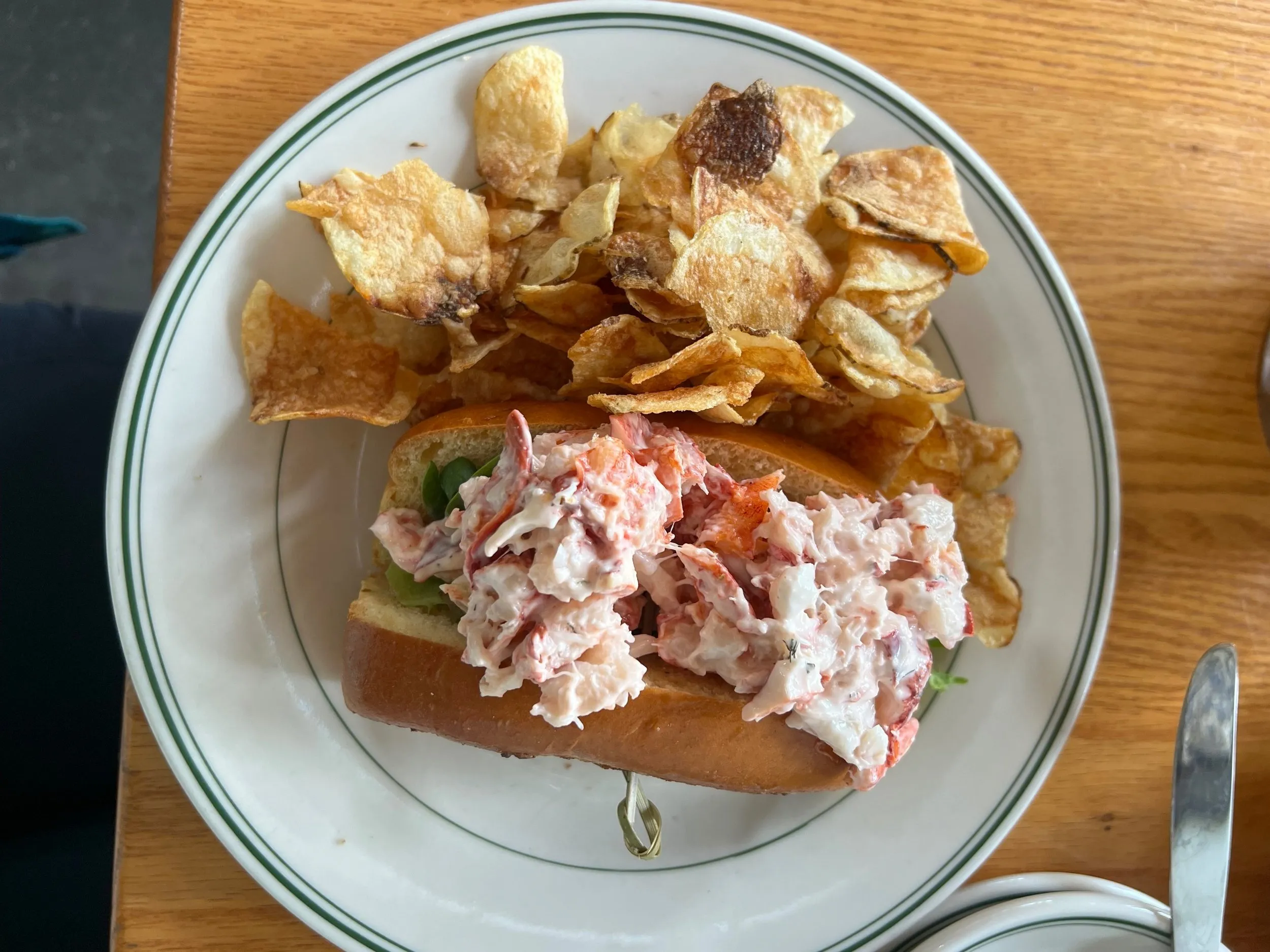 Gourmet lobster roll presentation at upscale Maine restaurant