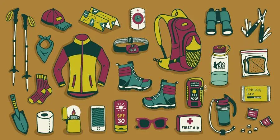 Essential hiking gear laid out for day hiking