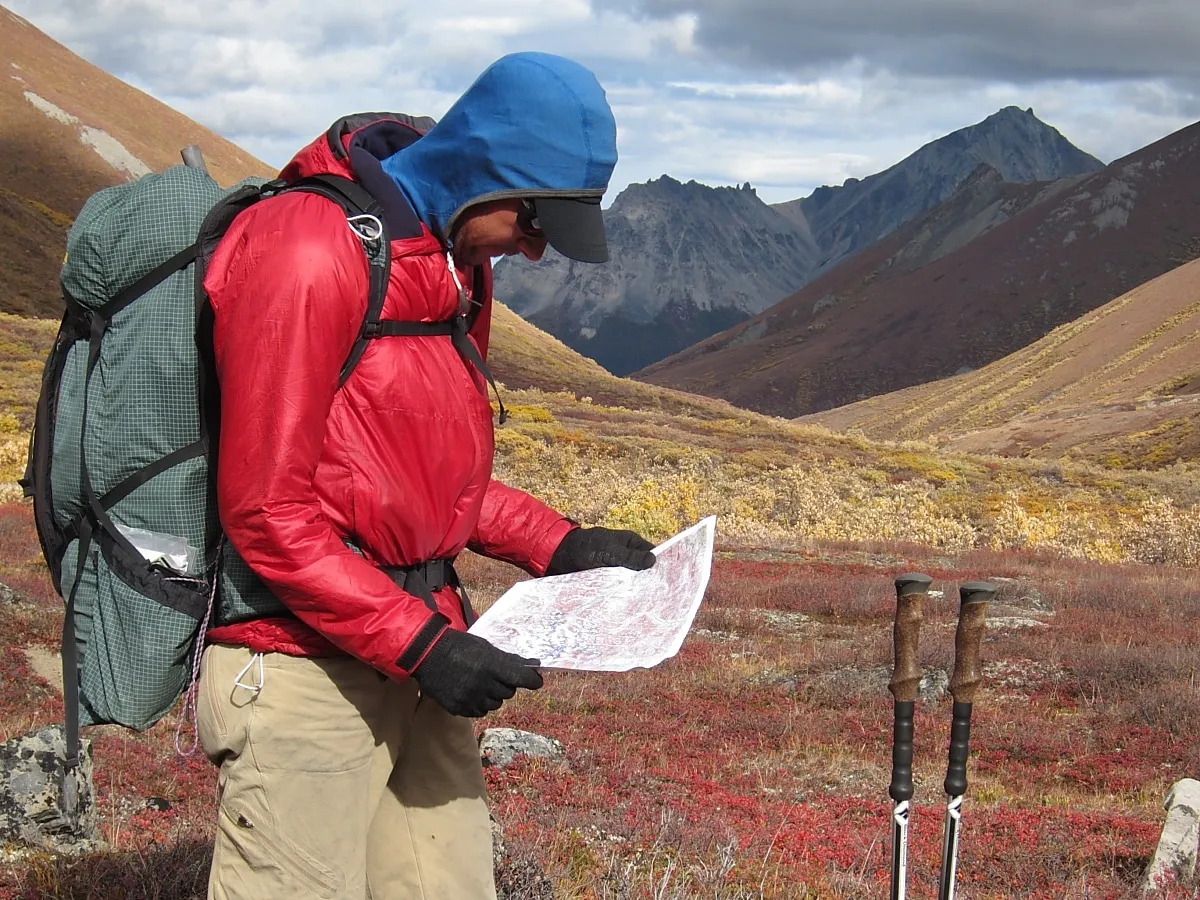 Topographic map and compass showing proper hiking navigation techniques
