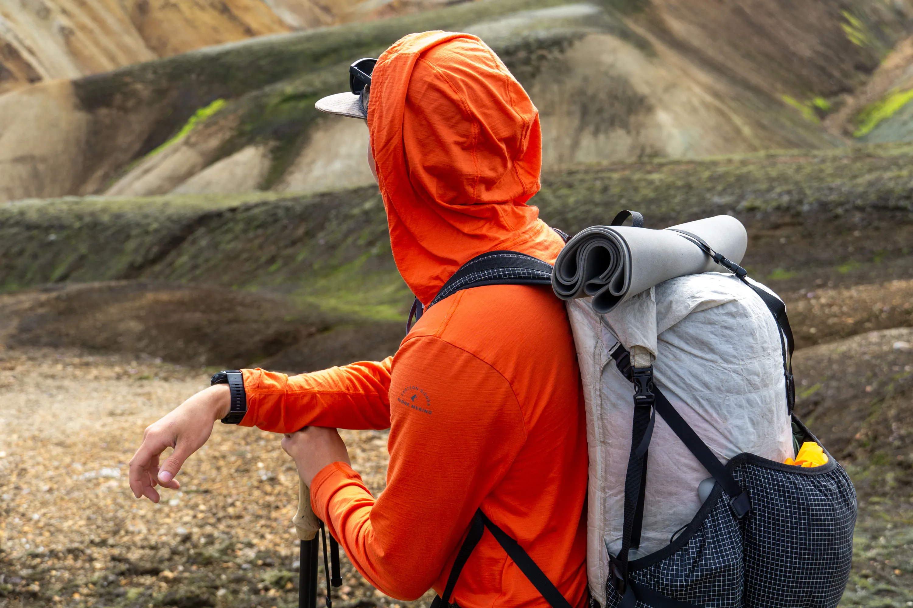 Various merino wool hiking shirts displayed showing different fabric textures and weaves for moisture wicking performance
