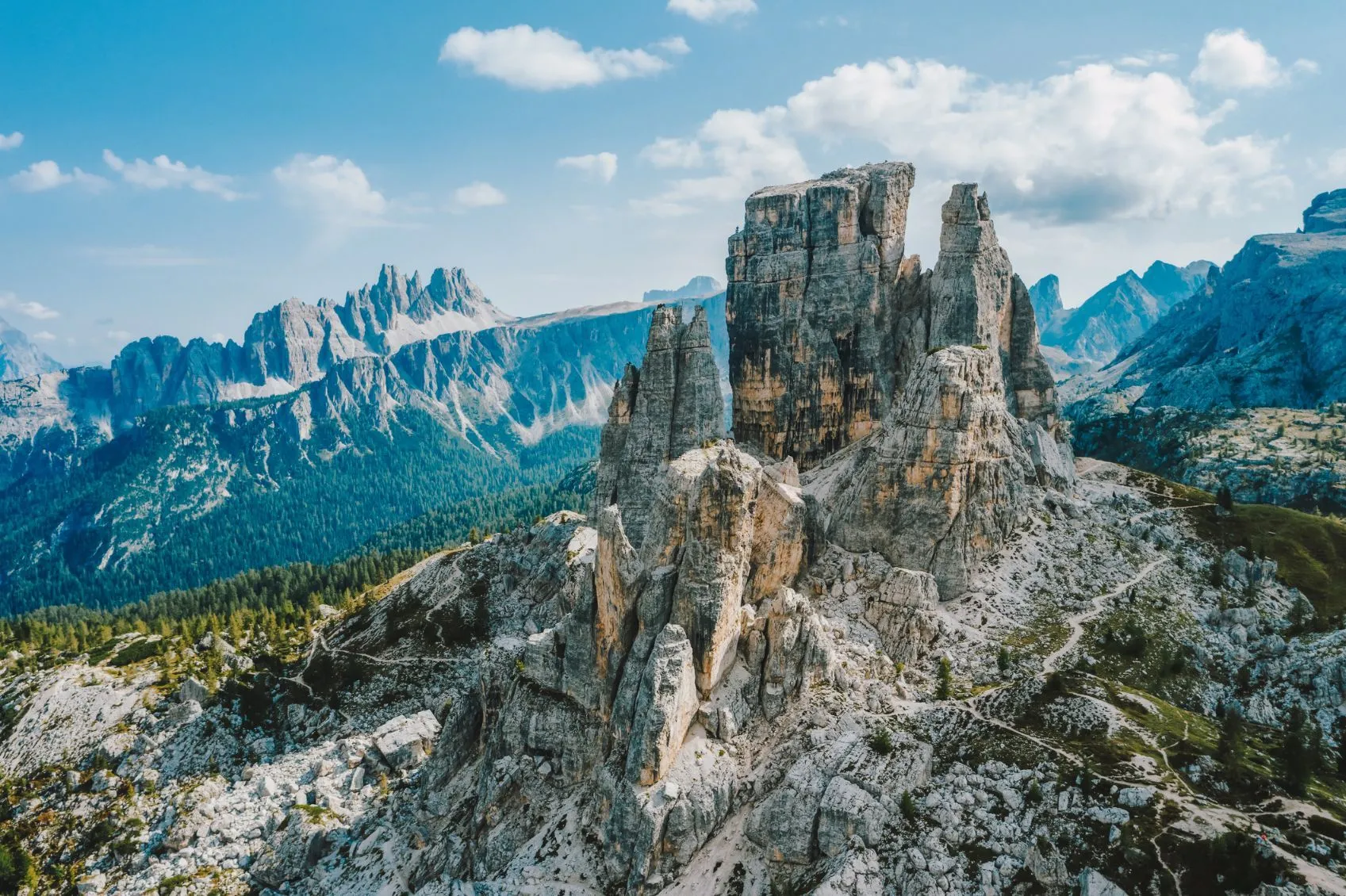 Spectacular Alpine mountain scenery with hiking trails winding through pristine valleys and snow-capped peaks