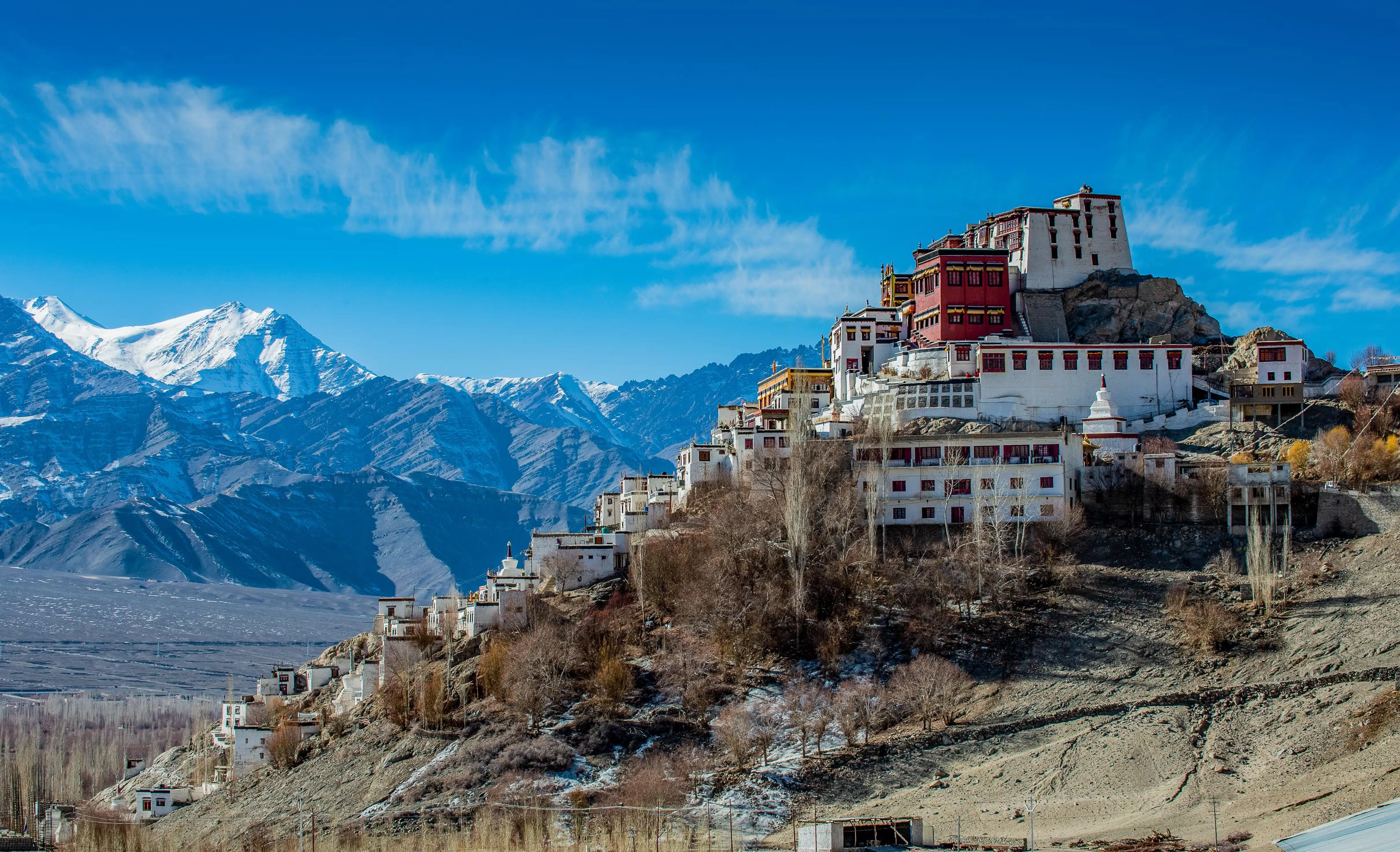 Stunning Himalayan landscape with snow-capped peaks and trekking trails perfect for beginners