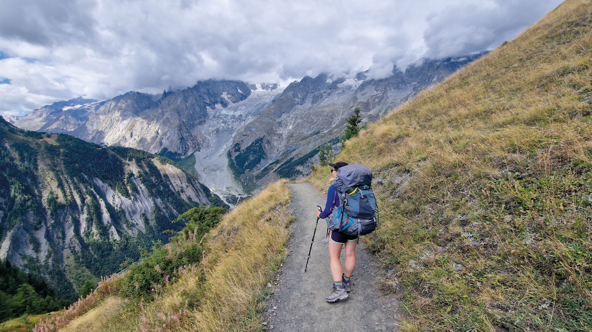 Hiker planning multi-day hiking trips with map and gear laid out