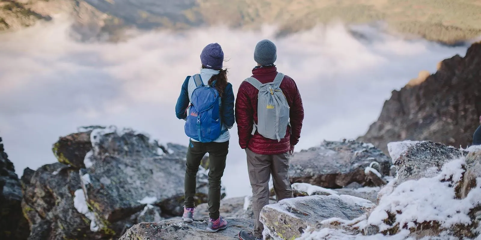 Hikers demonstrating proper cold weather hiking techniques and gear usage