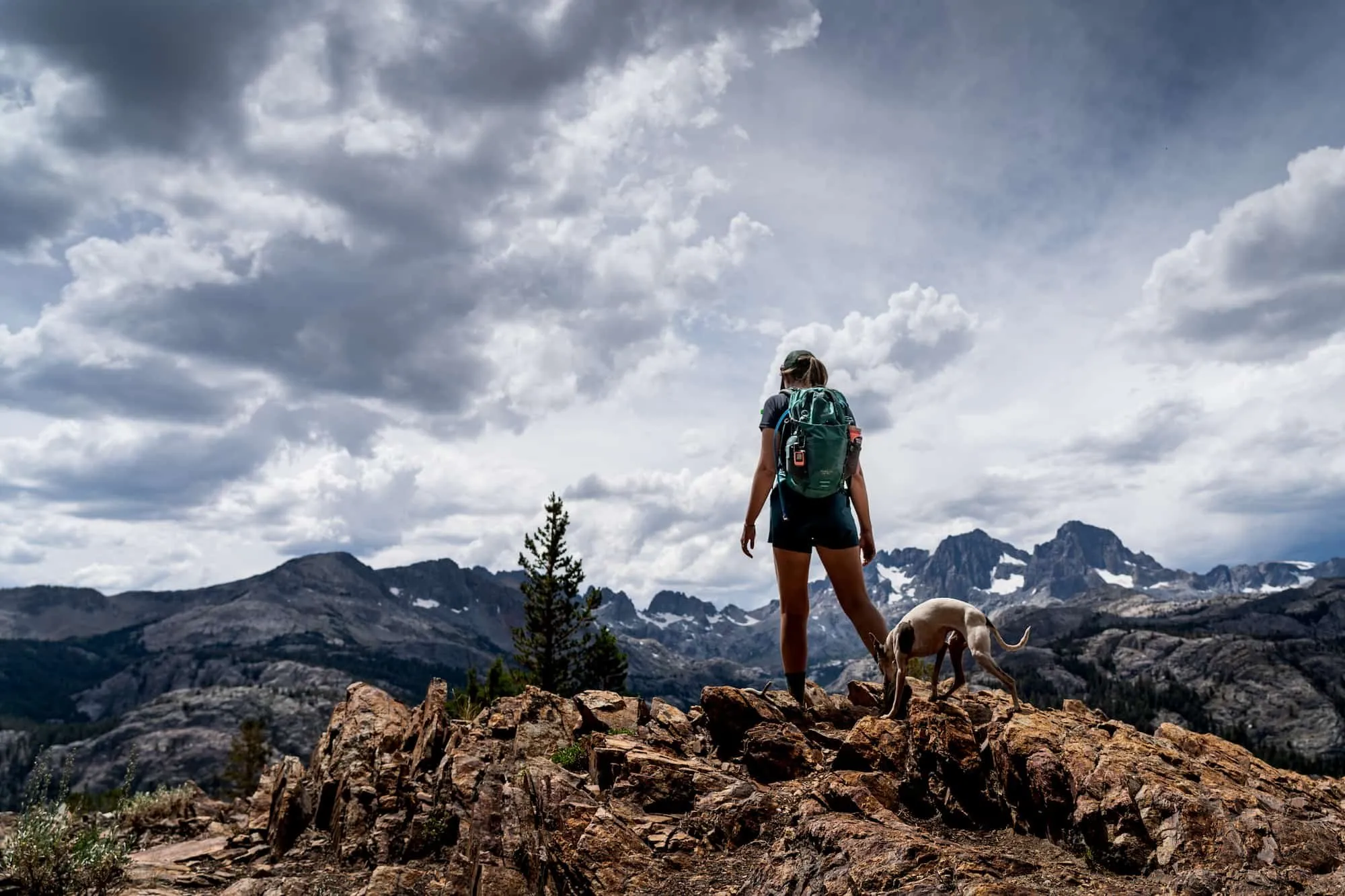 Solo hiker with safety gear and backpack in mountains