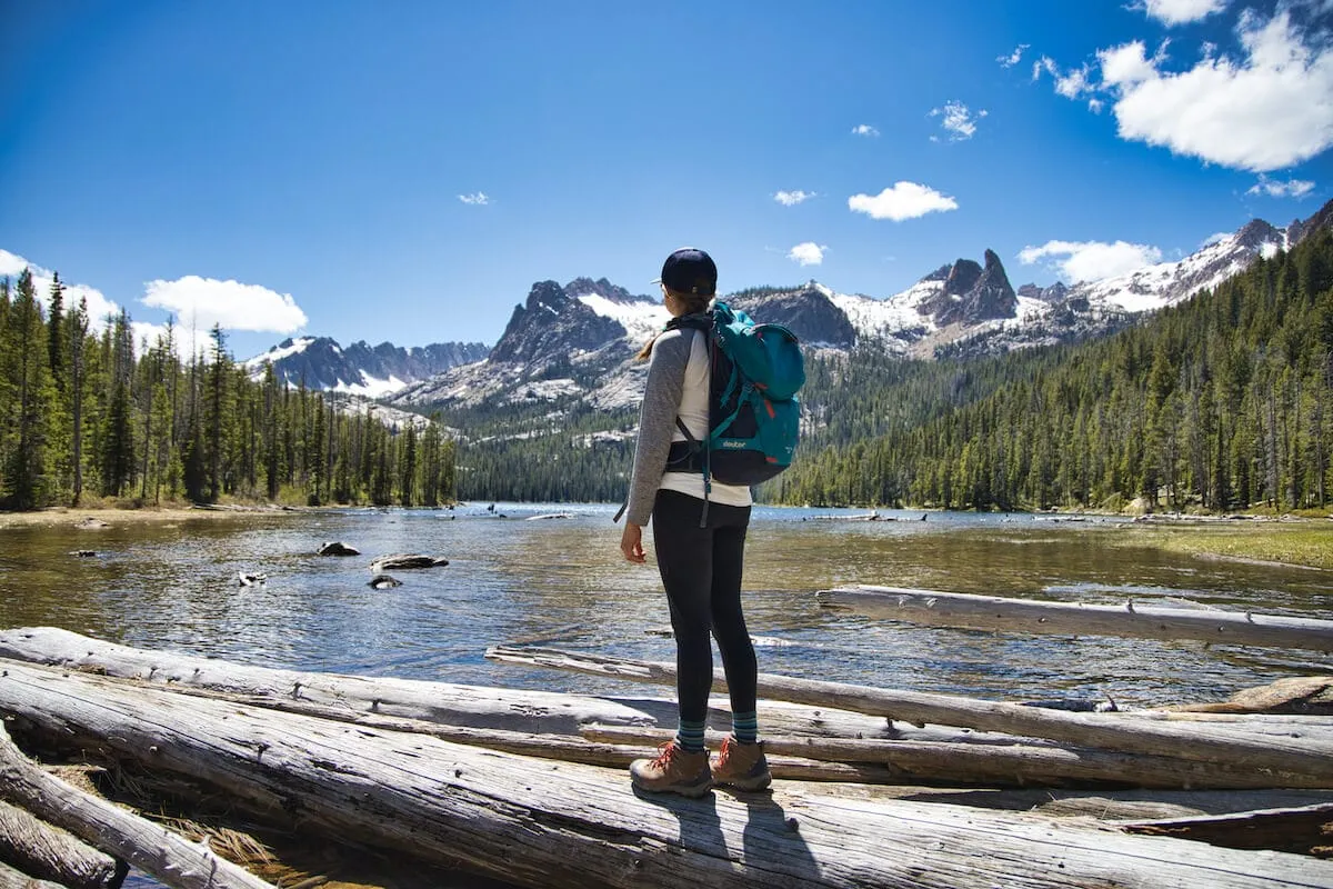 Solo hiker with safety gear on mountain trail