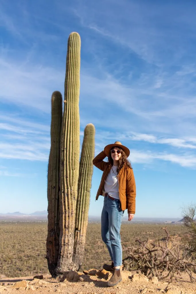 Confident solo female hiker on desert trail