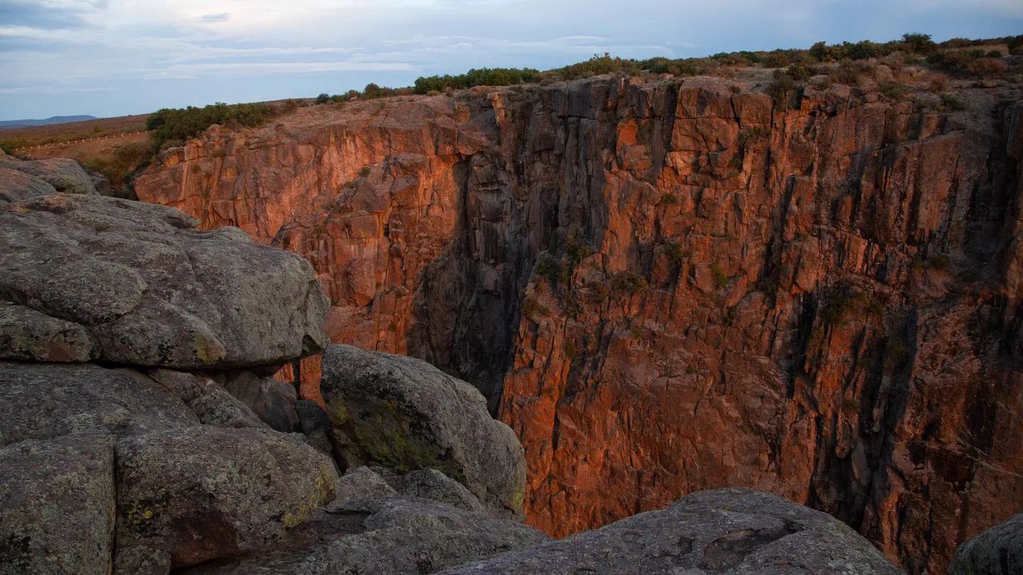 Dramatic view of Black Canyon cliff walls showcasing the steep terrain around camping areas