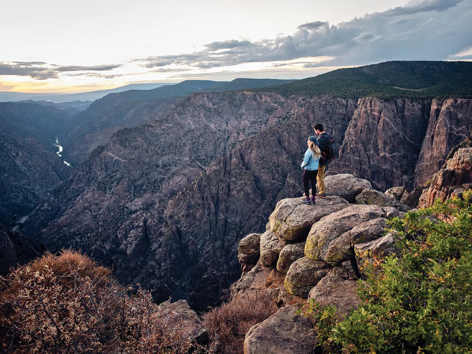Sunset view over Black Canyon of the Gunnison showing dramatic canyon walls and golden light
