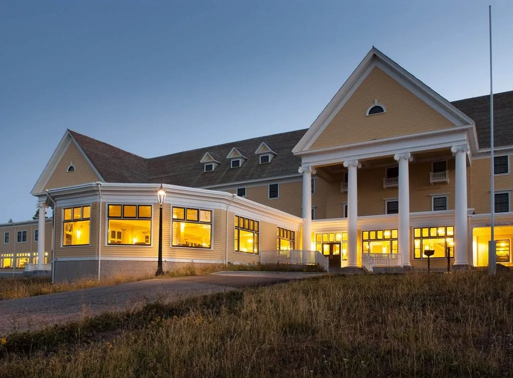 Lake Yellowstone Hotel exterior showing colonial architecture with yellow facade overlooking Yellowstone Lake
