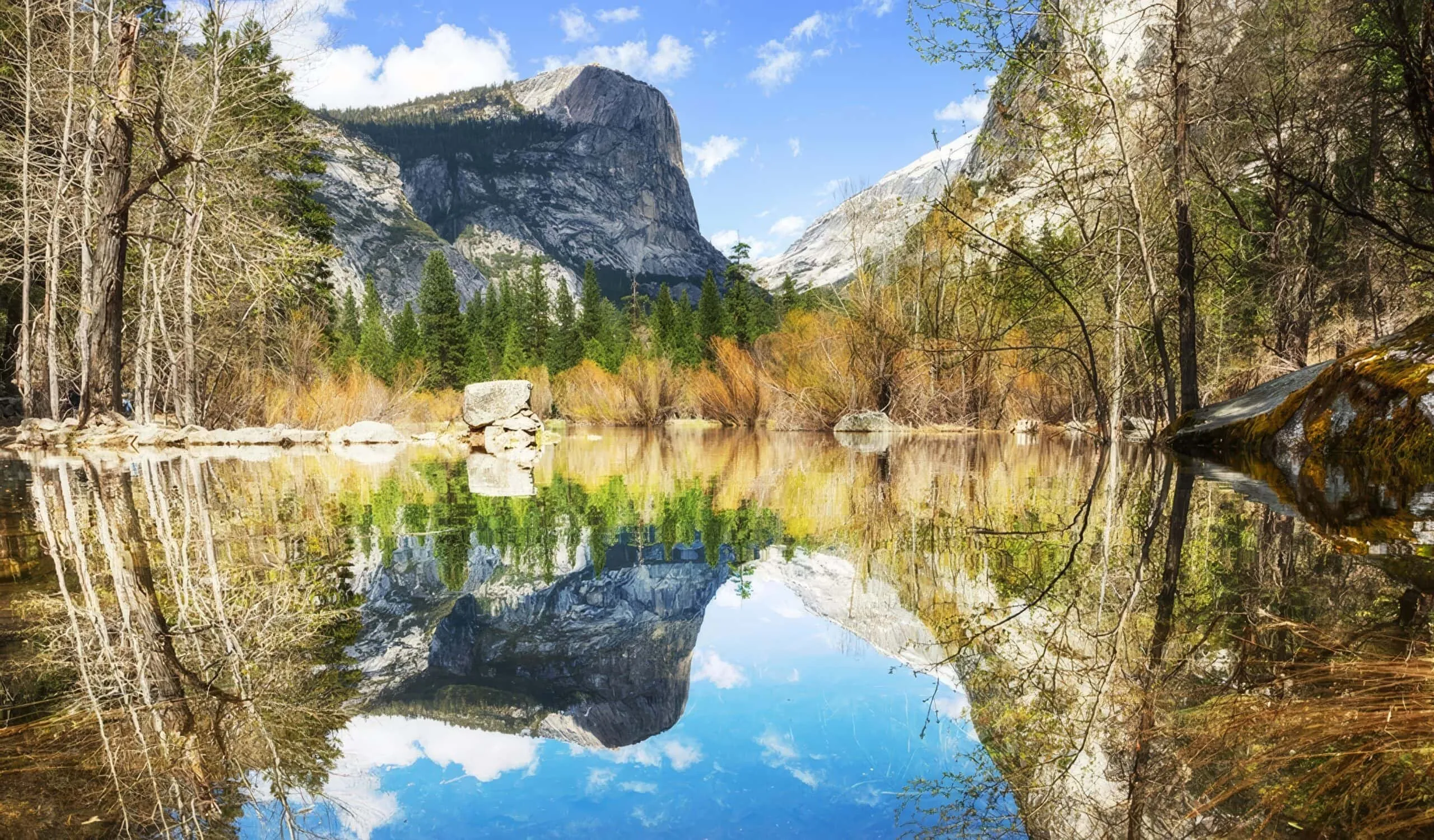 Mirror Lake Yosemite National Park showing perfect reflections of Half Dome and surrounding granite cliffs