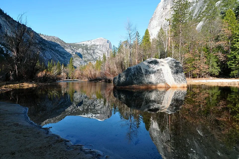 Perfect reflections of granite cliffs in Mirror Lake Yosemite National Park showcasing ideal photography conditions
