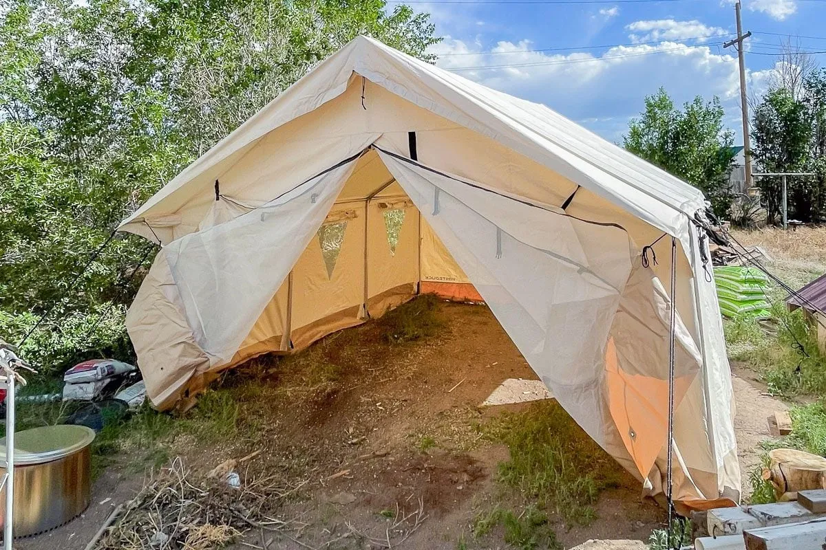 Professional tent setup showing proper technique for large camping tents