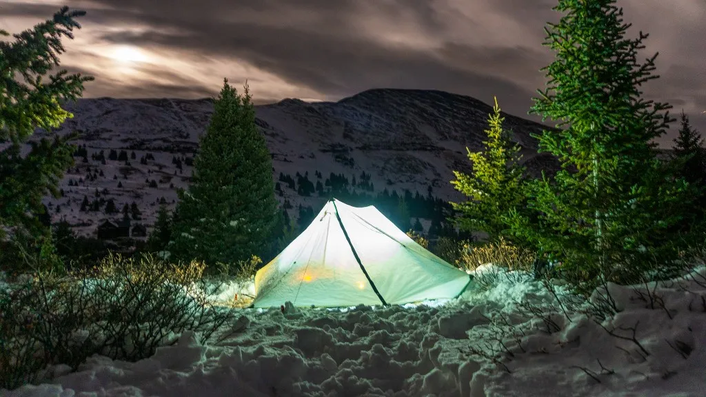 Ultralight backpacking tent setup in mountain wilderness camping