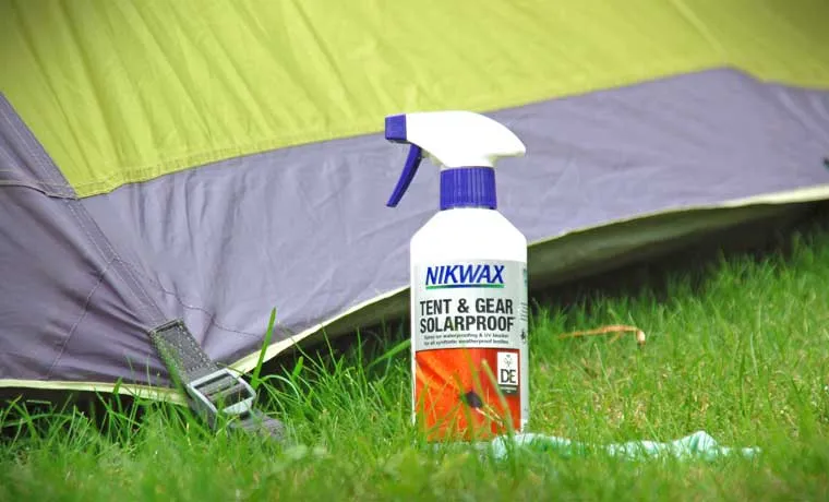 Tent waterproofing spray being applied to fabric