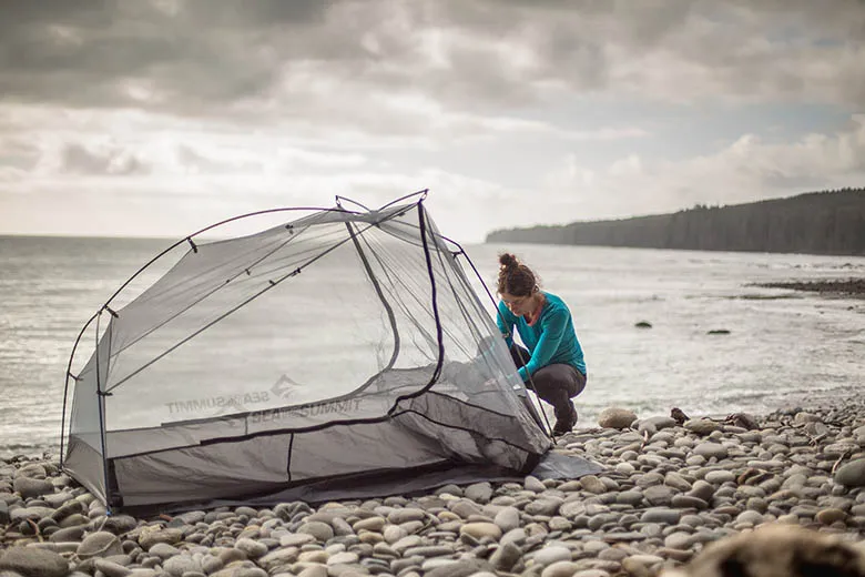 Sea to Summit Alto TR2 backpacking tent being set up on beach demonstrating versatile outdoor use