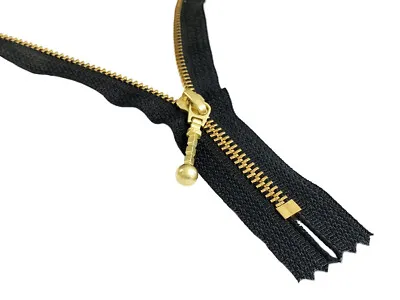 YKK golden brass metal zipper with fancy pull showing different finishes