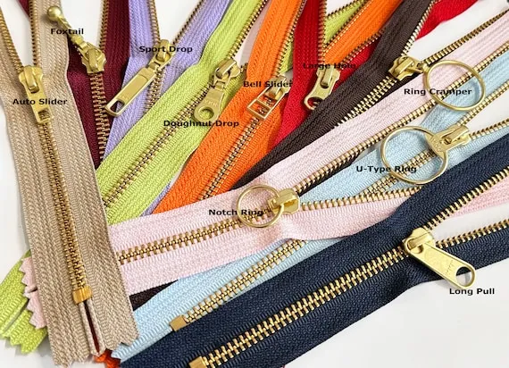 YKK golden brass metal zipper with fancy pull showing professional quality