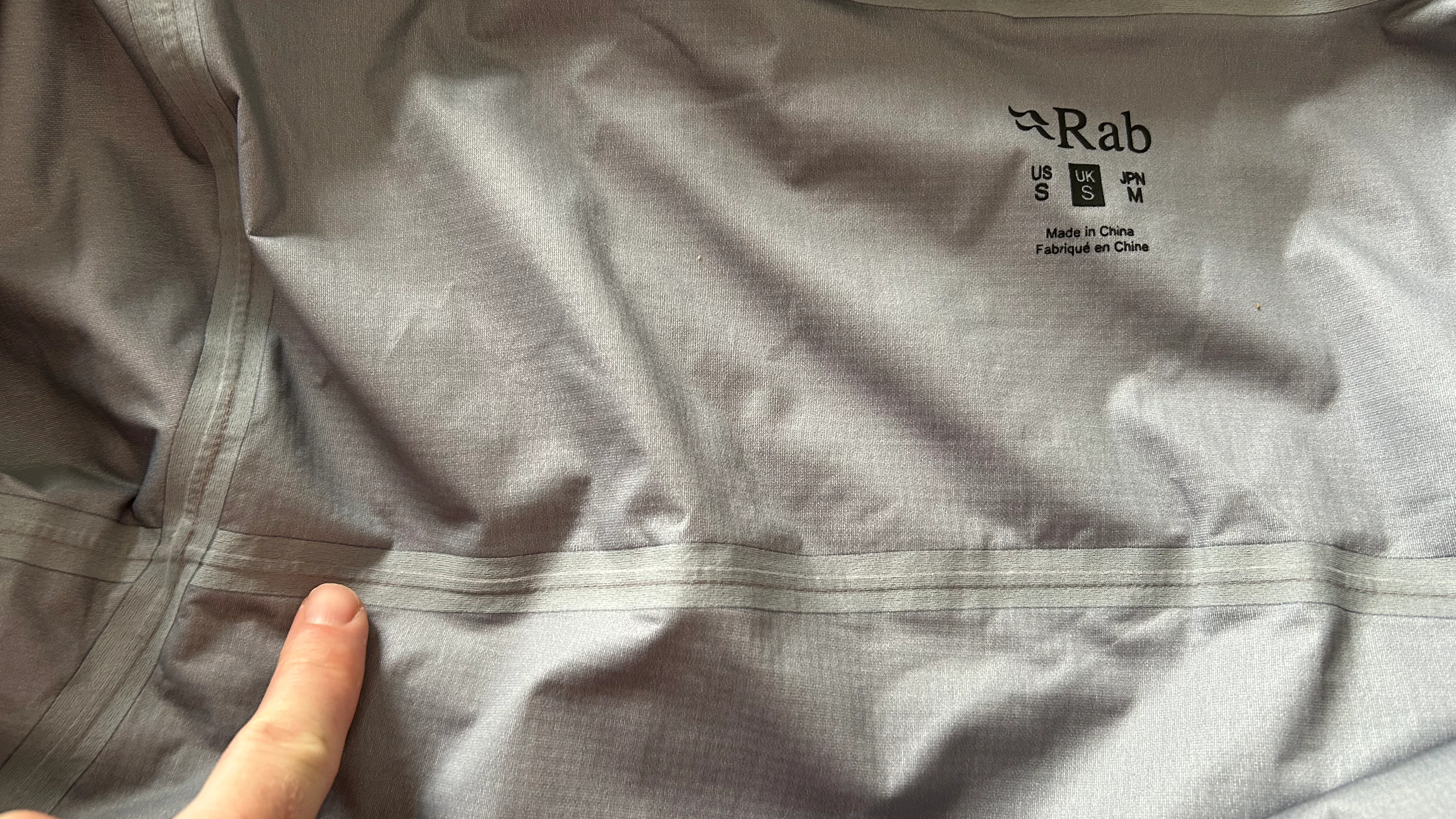 Comparison showing different types of seam sealing methods in waterproof jackets