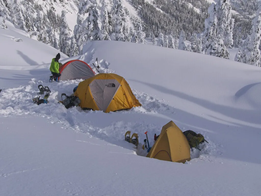 Comparison of 3-season and 4-season tents in harsh winter conditions showing the limitations of 3-season designs