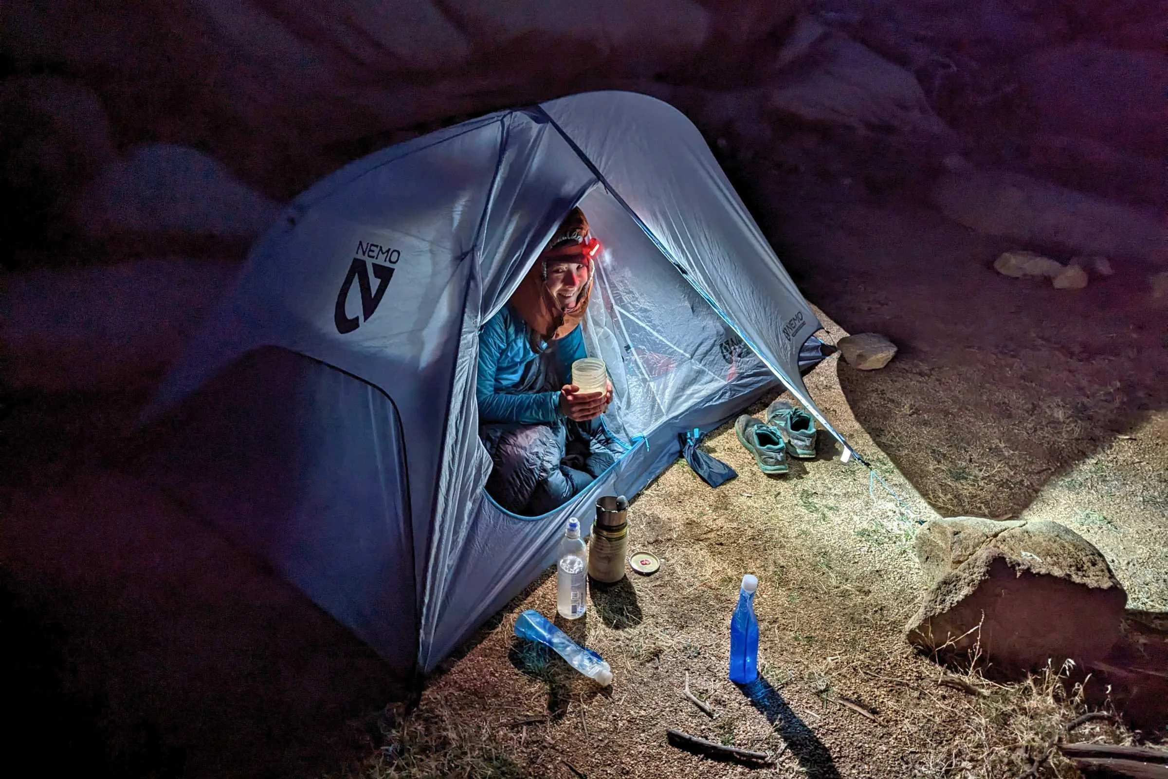 Ultralight backpacking tent setup in mountain wilderness