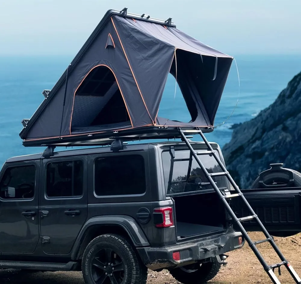 Hard shell roof top tent setup showing aerodynamic design and quick deployment