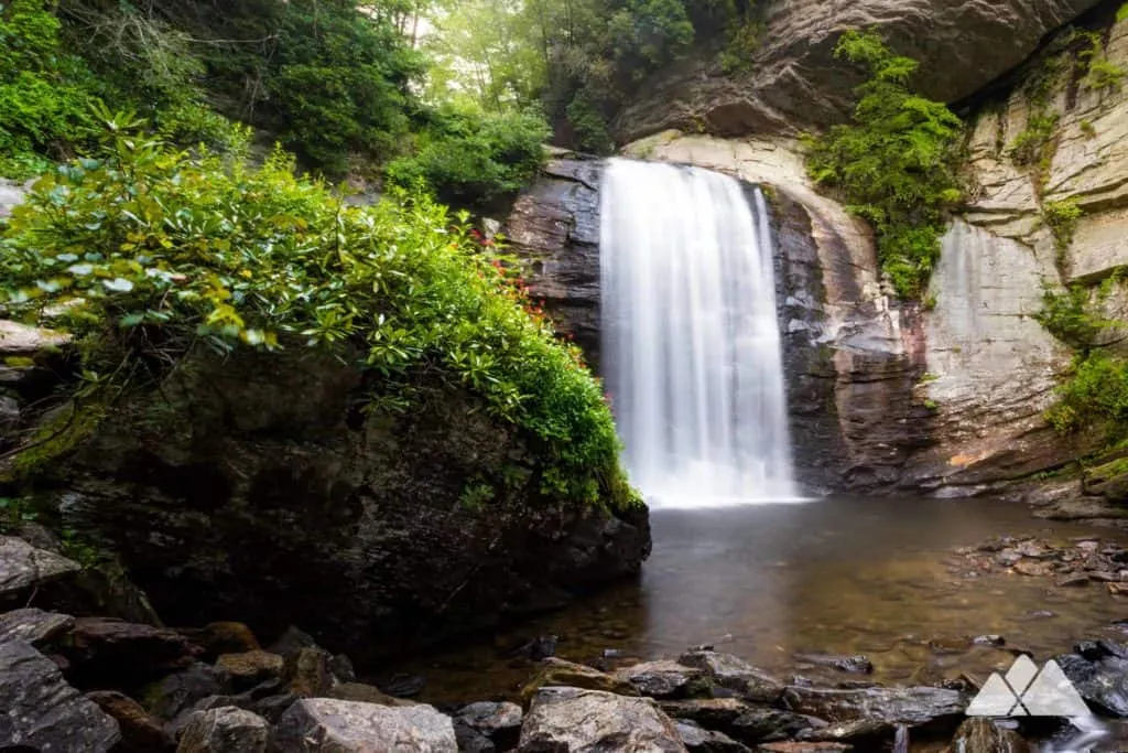 Stunning waterfall on an easy hiking trail with lush green forest surroundings