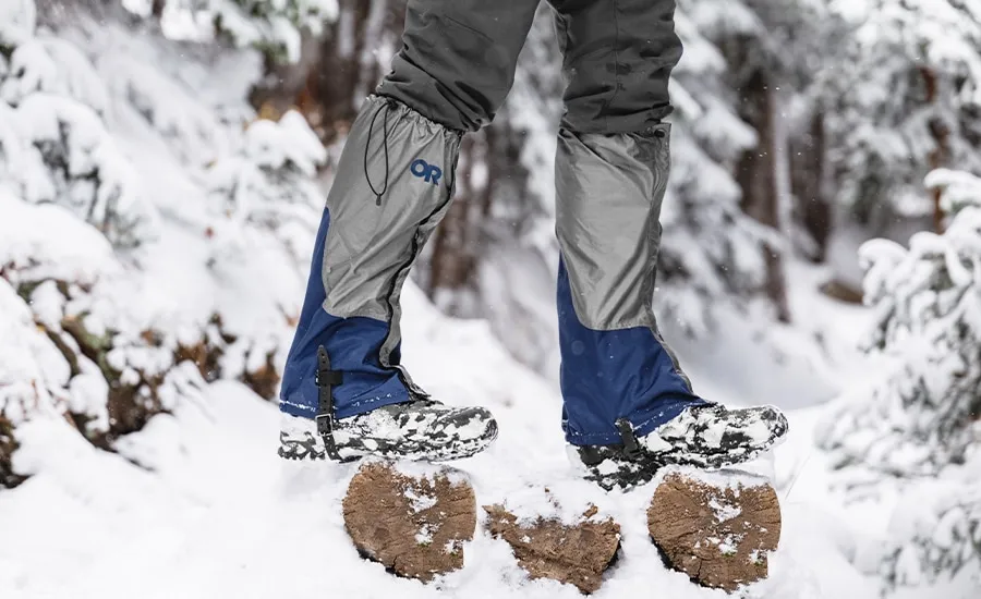 Outdoor Research Helium gaiters displayed on hiking boots in snow