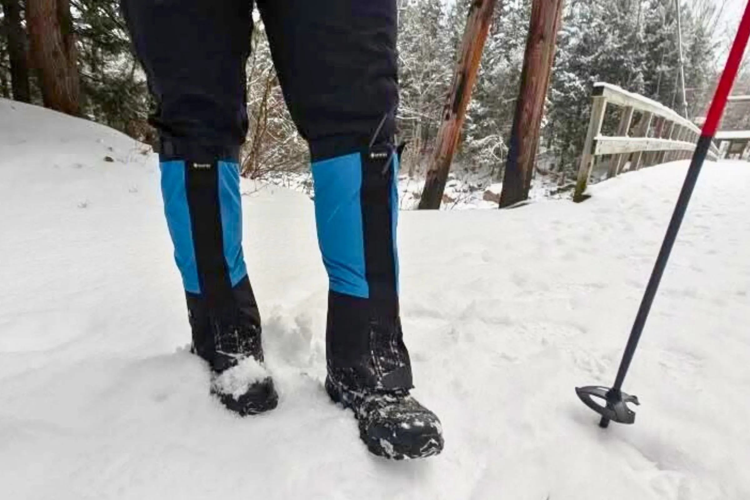 Hiker wearing snow gaiters during winter mountain hiking adventure